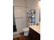 Clean bathroom with shower/tub combo, shelving and vanity at 2912 Squire Oak Ct, St Cloud, FL 34769