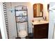 Clean bathroom with shower/tub combo, shelving and vanity at 2912 Squire Oak Ct, St Cloud, FL 34769