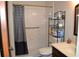 Clean bathroom with shower/tub combo, shelving, and vanity at 2912 Squire Oak Ct, St Cloud, FL 34769