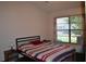Bright bedroom with a comfortable bed and large window at 2912 Squire Oak Ct, St Cloud, FL 34769