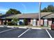 Brick condo with blue siding, landscaping, and parking at 2912 Squire Oak Ct, St Cloud, FL 34769