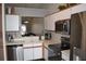 Kitchen with stainless steel appliances and white cabinets at 2912 Squire Oak Ct, St Cloud, FL 34769