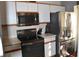 Stainless steel appliances and white cabinets in this kitchen at 2912 Squire Oak Ct, St Cloud, FL 34769