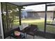 Relaxing screened patio with seating area at 2912 Squire Oak Ct, St Cloud, FL 34769
