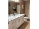 Bathroom showcasing a new vanity with a marble countertop and modern fixtures at 3006 Bonfire Beach Dr # 102, Kissimmee, FL 34746