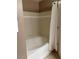 Clean bathroom with a soaking tub and shower, providing a relaxing retreat at 3006 Bonfire Beach Dr # 102, Kissimmee, FL 34746