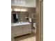 Bathroom with vanity, large mirror and toilet at 3006 Bonfire Beach Dr # 102, Kissimmee, FL 34746