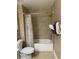 Bathroom featuring a shower-tub combo and decorative shower curtain at 3006 Bonfire Beach Dr # 102, Kissimmee, FL 34746