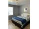 Comfortable bedroom with a queen bed and ceiling fan at 3006 Bonfire Beach Dr # 102, Kissimmee, FL 34746