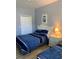 Bedroom featuring two beds with coordinated bedding, light wood floors, and a closet at 3006 Bonfire Beach Dr # 102, Kissimmee, FL 34746