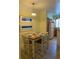 Charming dining area with a table set for four, next to the kitchen at 3006 Bonfire Beach Dr # 102, Kissimmee, FL 34746