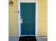 Green front door with white trim and a modern doorbell at 3006 Bonfire Beach Dr # 102, Kissimmee, FL 34746