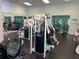 Community gym with modern equipment and large windows at 3006 Bonfire Beach Dr # 102, Kissimmee, FL 34746