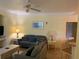 Relaxing living room with neutral decor, ceiling fan, and comfortable seating area at 3006 Bonfire Beach Dr # 102, Kissimmee, FL 34746