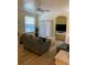 Comfortable living area featuring ample seating, a large window, and a mounted TV at 3006 Bonfire Beach Dr # 102, Kissimmee, FL 34746