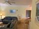 Warm and inviting living room with a ceiling fan and open layout to other living spaces at 3006 Bonfire Beach Dr # 102, Kissimmee, FL 34746