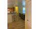 Open-concept living area with breakfast bar to the kitchen and comfortable seating at 3006 Bonfire Beach Dr # 102, Kissimmee, FL 34746