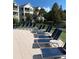 Resort-style pool area with lounge chairs, ideal for relaxation and enjoyment at 3006 Bonfire Beach Dr # 102, Kissimmee, FL 34746