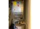 HVAC System with water heater found inside utility closet of home at 3006 Bonfire Beach Dr # 102, Kissimmee, FL 34746