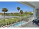 Balcony overlooking a lake and community amenities, offering picturesque views at 3088 Parrot Head Pl, Kissimmee, FL 34747