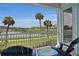 Serene balcony overlooking the resort pool and lake at 3088 Parrot Head Pl, Kissimmee, FL 34747