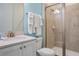 Clean bathroom with a walk-in shower and modern vanity at 3088 Parrot Head Pl, Kissimmee, FL 34747