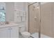 Clean bathroom with a walk-in shower, toilet, and white vanity at 3088 Parrot Head Pl, Kissimmee, FL 34747