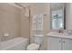 Clean bathroom with a tub, toilet and vanity at 3088 Parrot Head Pl, Kissimmee, FL 34747