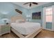 Guest bedroom with a queen-size bed and coastal-themed decor at 3088 Parrot Head Pl, Kissimmee, FL 34747