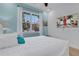 Comfortable bedroom with a queen bed and a large flat-screen TV at 3088 Parrot Head Pl, Kissimmee, FL 34747