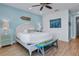 Bedroom with king-size bed, and coastal decor at 3088 Parrot Head Pl, Kissimmee, FL 34747