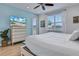 Main bedroom with large windows and a TV at 3088 Parrot Head Pl, Kissimmee, FL 34747