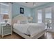 Bedroom with a queen-size bed and balcony access at 3088 Parrot Head Pl, Kissimmee, FL 34747
