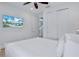 Spacious bedroom with a large TV and built-in closet at 3088 Parrot Head Pl, Kissimmee, FL 34747