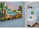 Bright bedroom with white furniture and beach-themed art at 3088 Parrot Head Pl, Kissimmee, FL 34747