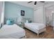 Bedroom with two twin beds and ensuite bathroom at 3088 Parrot Head Pl, Kissimmee, FL 34747