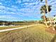 Resort-style community with pond, walking paths, and lush landscaping at 3088 Parrot Head Pl, Kissimmee, FL 34747