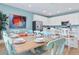 Spacious dining room with a large wooden table and seating for eight at 3088 Parrot Head Pl, Kissimmee, FL 34747