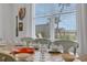Large dining table with seating for eight, overlooking a water view at 3088 Parrot Head Pl, Kissimmee, FL 34747