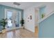 Bright and airy entryway with tile floors and double doors leading to the outside at 3088 Parrot Head Pl, Kissimmee, FL 34747