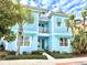 Two-story light blue house with landscaping at 3088 Parrot Head Pl, Kissimmee, FL 34747