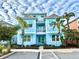 Two-story light blue house with landscaping at 3088 Parrot Head Pl, Kissimmee, FL 34747
