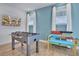 Game room with foosball and air hockey tables at 3088 Parrot Head Pl, Kissimmee, FL 34747