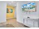 Bright hallway with a console table and artwork at 3088 Parrot Head Pl, Kissimmee, FL 34747