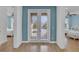 Bright hallway with access to bedrooms and balcony at 3088 Parrot Head Pl, Kissimmee, FL 34747