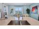 Kitchen island with double sink, quartz countertops, and breakfast bar at 3088 Parrot Head Pl, Kissimmee, FL 34747