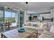 Spacious living area with patio access, offering views of the pool and backyard at 3088 Parrot Head Pl, Kissimmee, FL 34747
