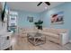 Relaxing living room featuring light beige sofas and a large TV at 3088 Parrot Head Pl, Kissimmee, FL 34747