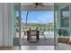 Private patio with outdoor dining set and adjacent pool access at 3088 Parrot Head Pl, Kissimmee, FL 34747