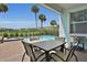 Patio with pool, table, chairs, and hot tub at 3088 Parrot Head Pl, Kissimmee, FL 34747